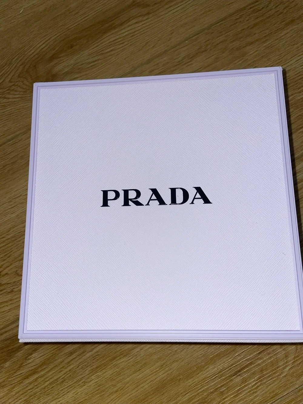 Prada lip stick and gem